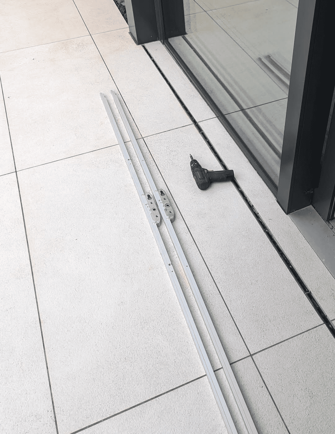 A sliding door being repaired by a professional locksmith