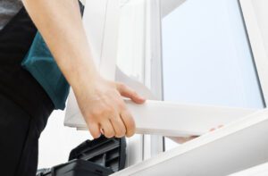 uPVC window being repaired by a professional locksmith