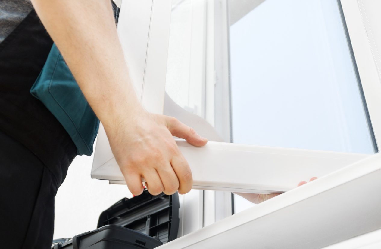uPVC window being repaired by a professional locksmith